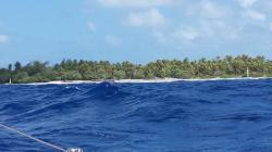 Rangiroa Tiputa entrance with small standing waves 1/2 hour after high tide slack water.