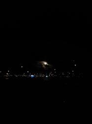 A moon sighting over the harbour off George Town, looking south from Chat and Chill Beach