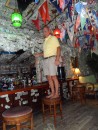 The captain hanging the traditional $1 to the Green Turtle Club anywhere you can find.