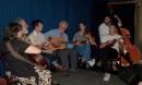 From left, Jeanne McDougall, Bob Zentz, Joseph Terrell of Mipso, Louis Allen, and  Libby Rodenbough, Wood Robinson and Jacob Sharp of Mipso: Performing at the Deepwater Theater during a workshop called "Our Favorite Songs."