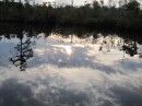 The late evening sky reflected in the water near the entrance of the canal.