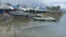 Marina work area under water. The speedboat is the harbour police launch. It
