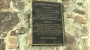 A plaque on the old church wall commemorating Longfellow.
