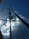 Ned goes up the mast on coral watch duty, in a beautiful anchorage just north of Guadeloupe