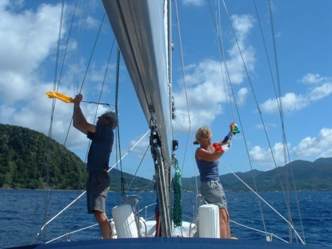Teamwork as Jo and Giles hoist the custom (Giles) and courtesy (Jo) flags, approaching the breathtakingly beautiful Dominican co