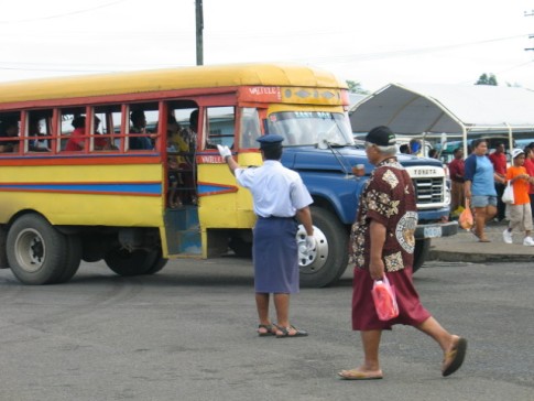 One of the many colourful buses and policman in a skirt!
