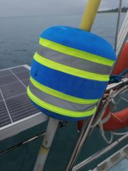 Danbuoy got a new jacket: The yellow stripes on the danbuoy disintegrated so crew made straps, fastened with velcro from reflective material to cover the missing yellow stripes.  Will hopefully be more easily spotted in the ocean when used to mark a 