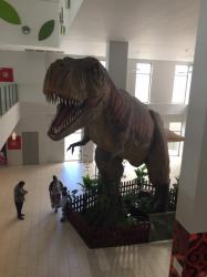 Dinosaur : Big dinosaur statue inside two story building with local food stalls on the top floor.  Feels like this animal wants to share your food.  New World shopping centre on the ground floor.  