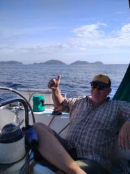 Hen and Chickens: Sailing past the Hen and Chicken Islands on our way to Great Barrier.  Captain enjoys sailing again.