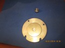 This photo shows the brass disc in place on top of the Teflon bearing.