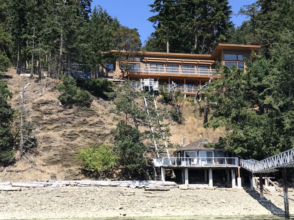 House from our dock: House coming along as seen from Madrona on our dock