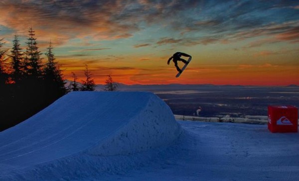 Edwin is into photography, he took this picture of a friend at sunrise up at Grouse with Vancouver in the background.  Awesome