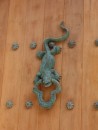 Lizard door knocker.  Each house has a different knocker to indicate profession of owner.  This one is royalty.