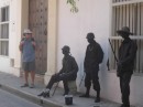 Russ with local boys all painted black and acting as statues