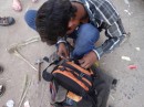 As we were walking through the streets, this man noticed that one of the zippers was broken. 