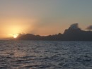 Leaving Tahiti. Sunset behind Moorea.
