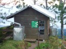 The hut with its water catchment container.