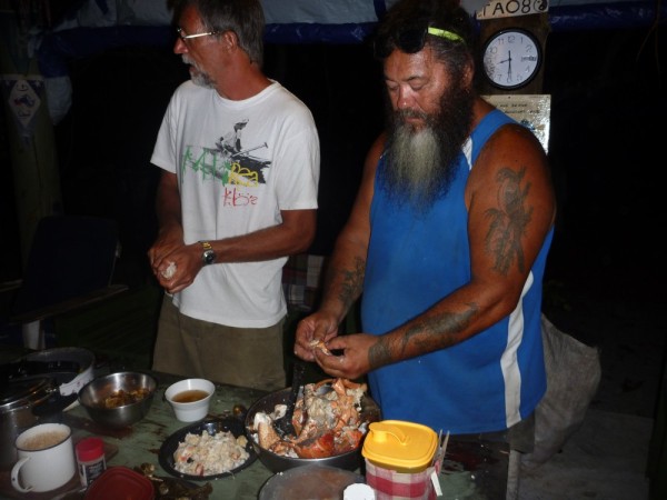 Liam prepared the fire for boiling the crabs and then James and Michael cracked the shells and removed the meat.