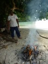 Sikki, cooking us a breadfruit on his camp fire.