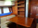 Port settee, book shelf and table completely open.