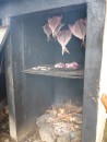 We had to wait a bit for the wood to burn down before we closed the door to the smoker. If it is too hot inside, the fish will cook, not smoke.