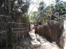 The streets are uneven, rough, dirt paths, which must turn into slippery, sloppy mud during rainy season.