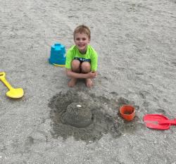 Grandson Evan with his sand castle