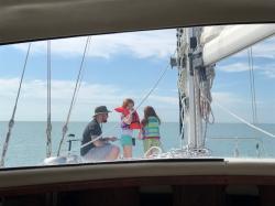 Jesse with Brookln and Kamryn on the bow during a day sail in the Gulf of Mexico off Venice