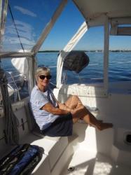 Kim relaxing in the cockpit on our way to FMB down the ICW
