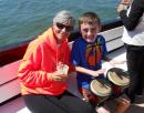 Grammy and Owen on Pieces of Eight pirate ship