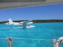 Seaplane lands next to Delilah and taxis to "pig" beach