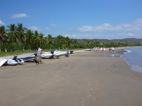 Dinghies of anchored boaters on beach at Bahia Tenacatita