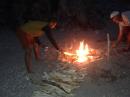 Roasting marshmallows at beach fire party