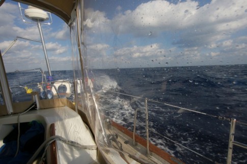 We were fortunate to have a full cockpit enclosure. It kept out the cold wind and spray as the boat pounded along through the waves.