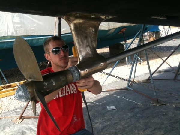 Aaron works on polishing the MaxProp and shaft.