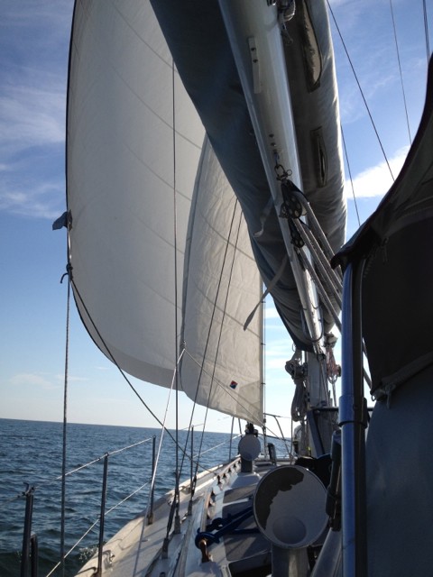 Underway with all three sails up on a beam reach.
