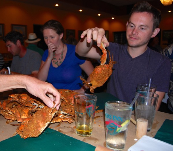 Mike and Megh select crabs from the heap of four dozen.