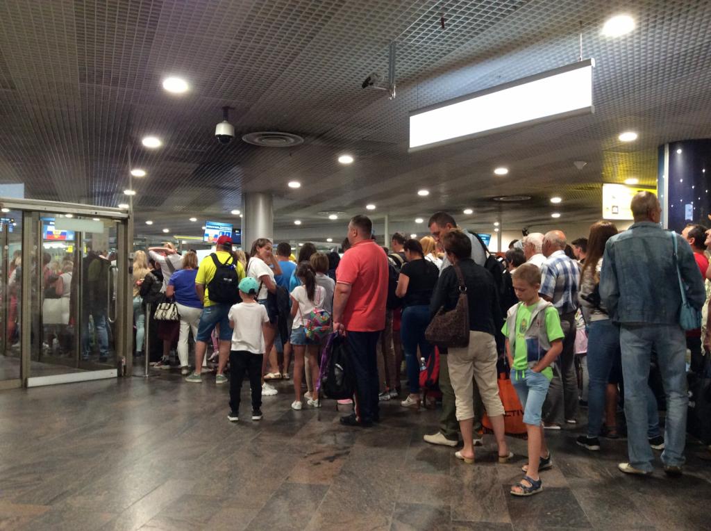 Passport control, Sheremetyevo Airport, Moscow: Lots of Russian families returning from holidays in the sun.