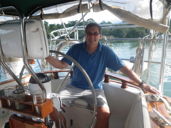 a happy Jim at the helm