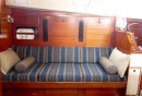 Starboard-side Saloon - 1 display cubby, Bar with drop leaf table (middle), drop leaf table with pull-out upper drawer and bottom stowage 