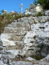 These steep serpentine steps cut into the limestone curve back and forth 6 or 7 times past the last few stations of the cross. 