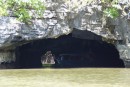 entrance to Bat Cave, with tourist boat heading through