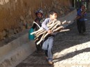 Early morning chores-young children gathering wood and water