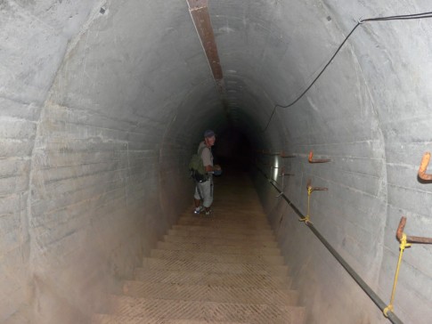 Michael going down a set of stairs deep into the tunnel system