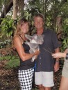 Deb and Mike cuddle a koala