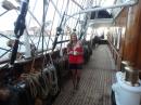 Debby stands by the rows of belaying pins by each mast.  The ship has over 30 miles of running rigging to control 33 sails... 