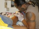 Matu Tiki works on Mikes tatoo