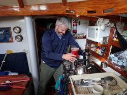 Kevin tries his hand at making coffee in the rolly seas