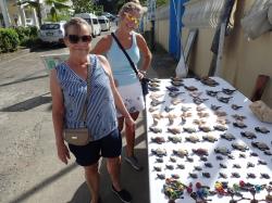Laura and Debby check out the handcrafts of a vendor at Marigot Bay