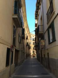 The narrow streets of Mallorca cast shadows that keep things cool in the hot Summer